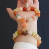 12MM large natural Xinjiang gold thread jade bracelet couple style ethnic style round bead hanging cat paw sandalwood bracelet wholesale Application Scenario